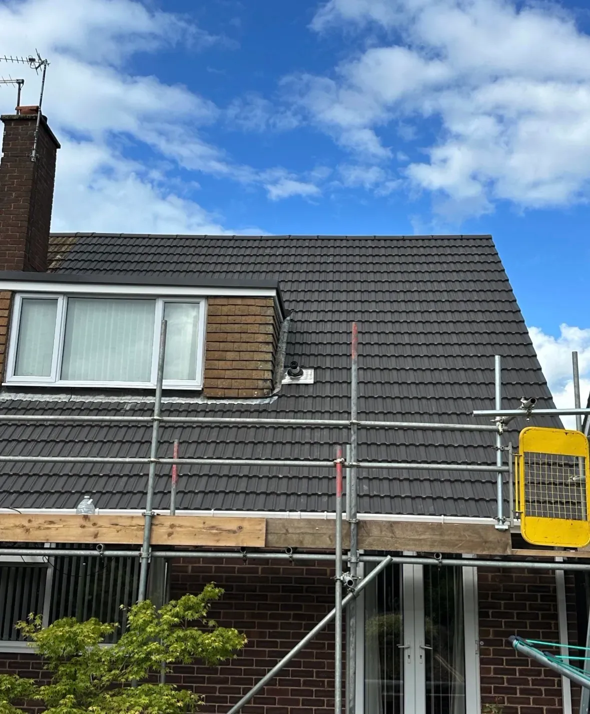 Completed tile roof replacement by Coventry Roofing Group