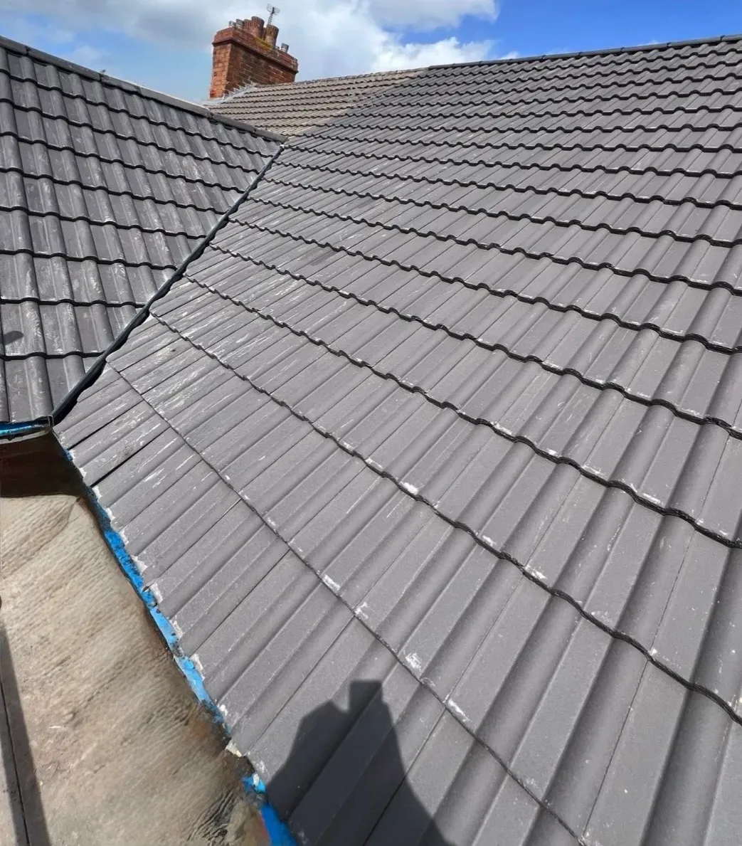 Urgent roof valley and tile repair in progress
